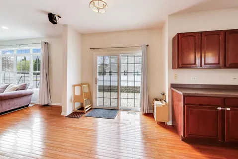 a bedroom with furniture and a large window