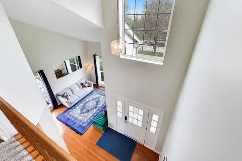 a bedroom with a bed and a flat tv screen