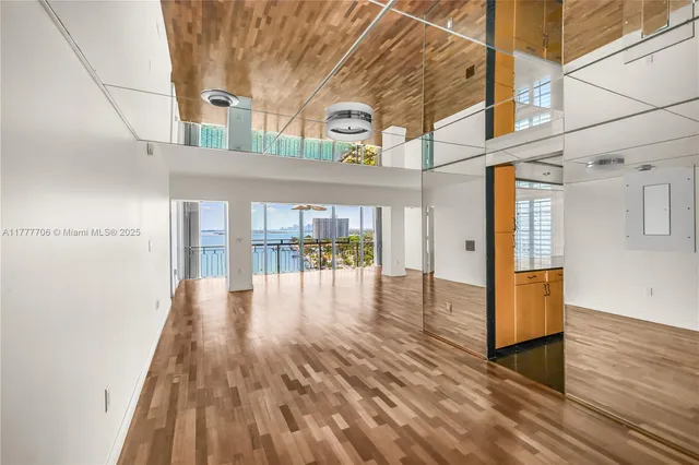 a view of outdoor space with wooden floor and windows