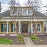 front view of a house with a small yard