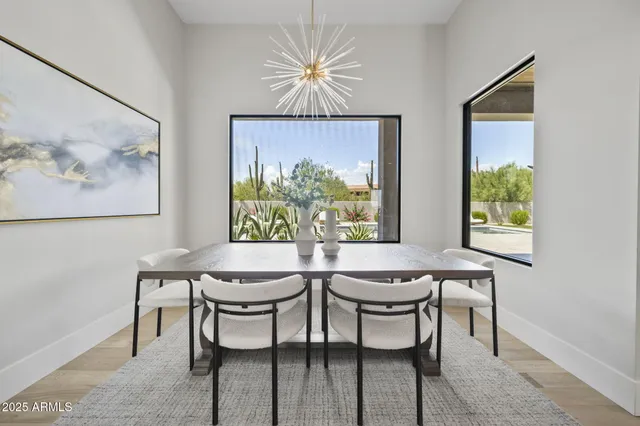 a living room with furniture large window and a fireplace