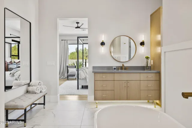a view of a hallway with wooden floor and windows