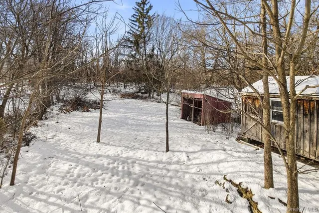 a view of a yard covered in snow
