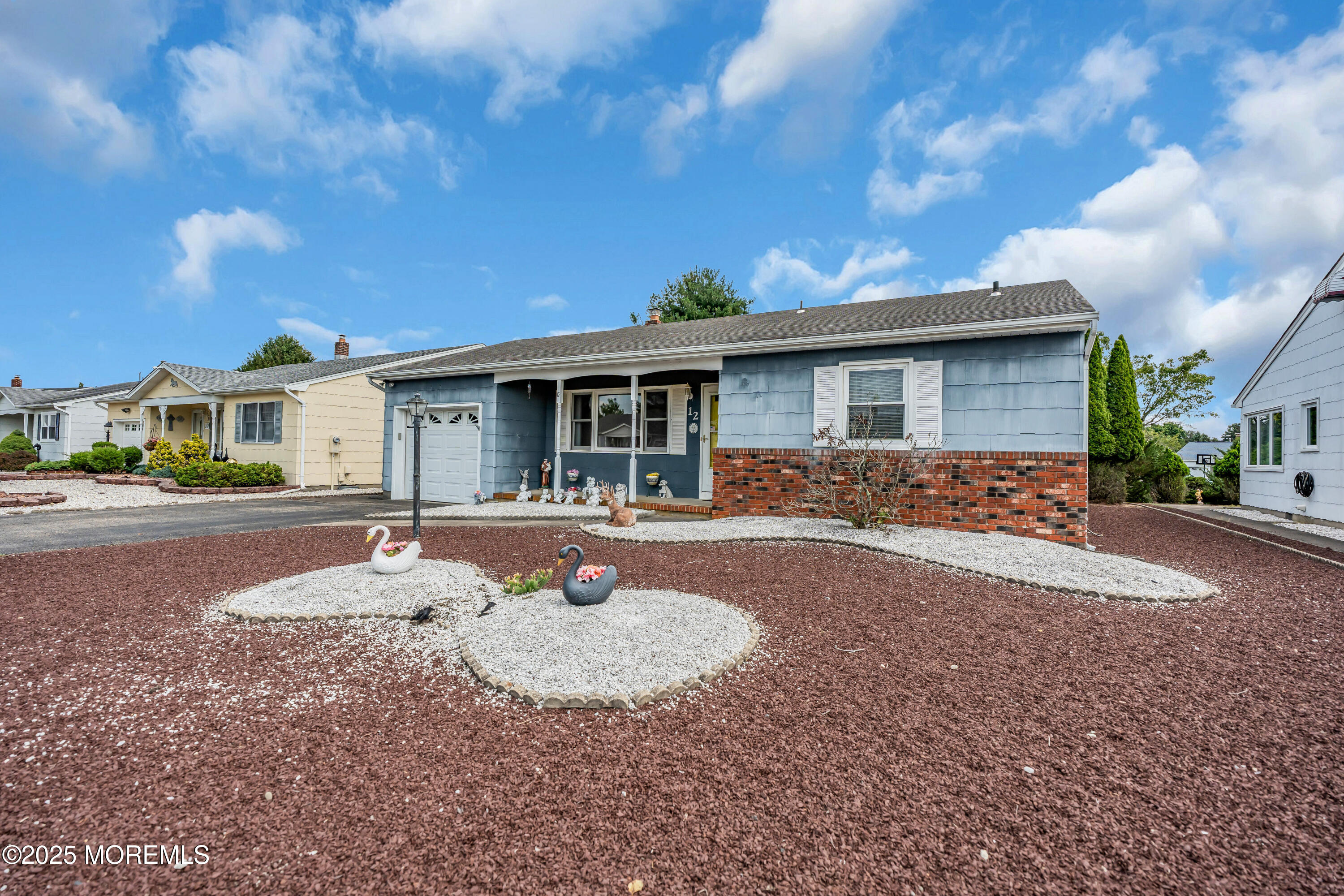 12 Jericho Road Toms River, NJ 08757 - Photo 3 of 25 a front view of a house with a yard