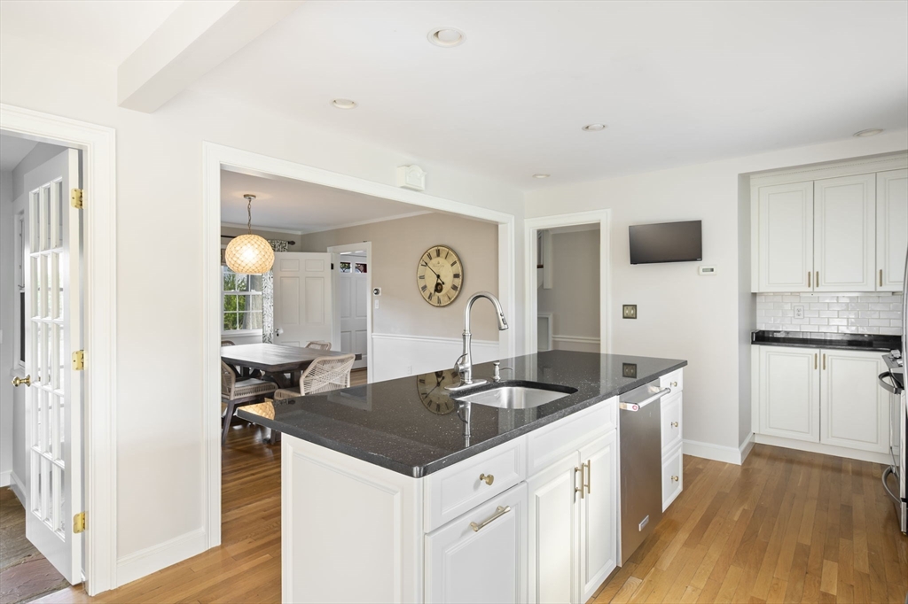 19 Lantern Lane Milton, MA 02186 - Photo 11 of 39 a kitchen that has a sink and a stove in it