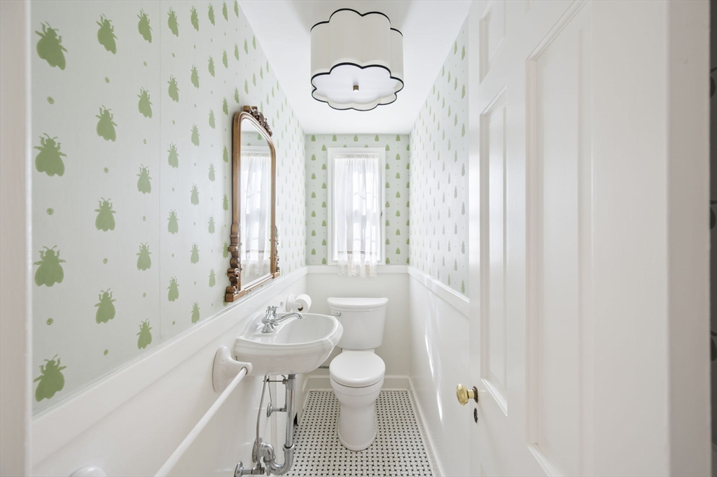 19 Lantern Lane Milton, MA 02186 - Photo 15 of 39 a bathroom with a granite countertop sink a toilet and a bathtub