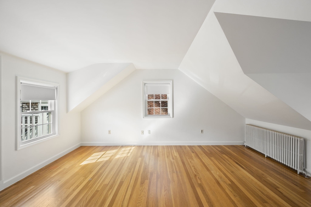 19 Lantern Lane Milton, MA 02186 - Photo 21 of 39 a view of a room with wooden floor and white walls