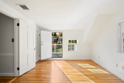 a view of a house with backyard and porch