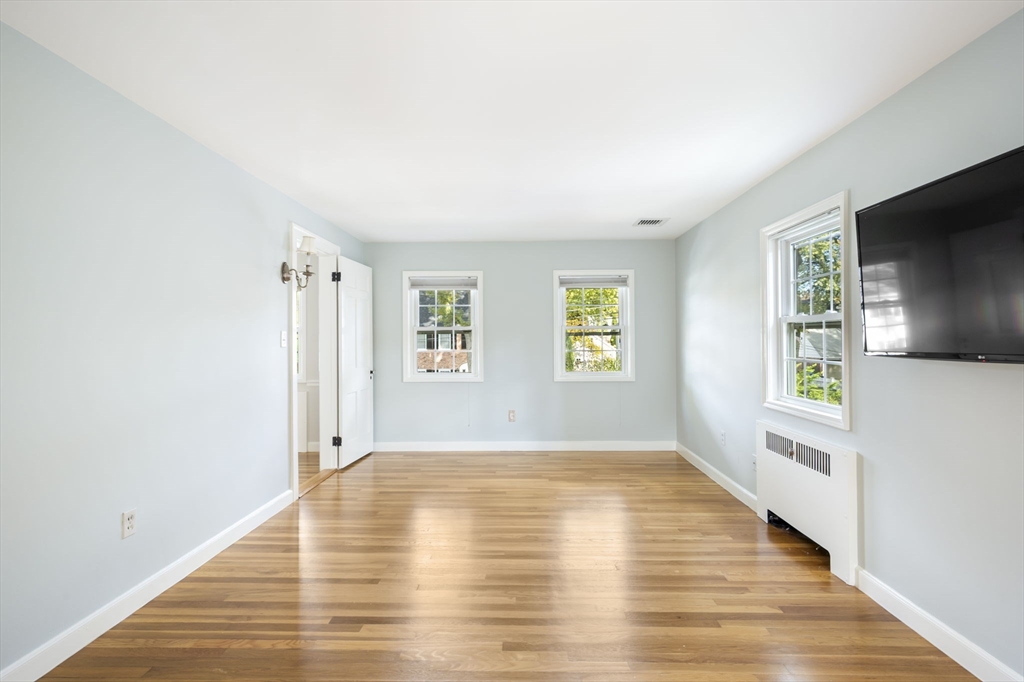 19 Lantern Lane Milton, MA 02186 - Photo 25 of 39 a view of empty room with wooden floor and fan