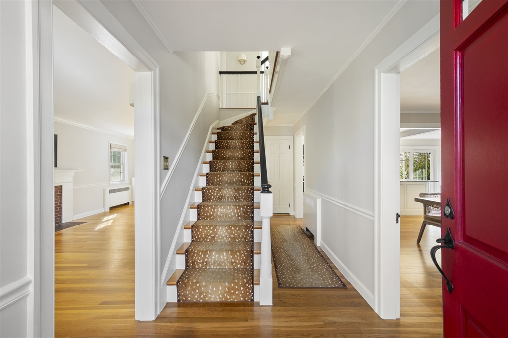 19 Lantern Lane Milton, MA 02186 - Photo 4 of 39 a view of entryway and hall with wooden floor