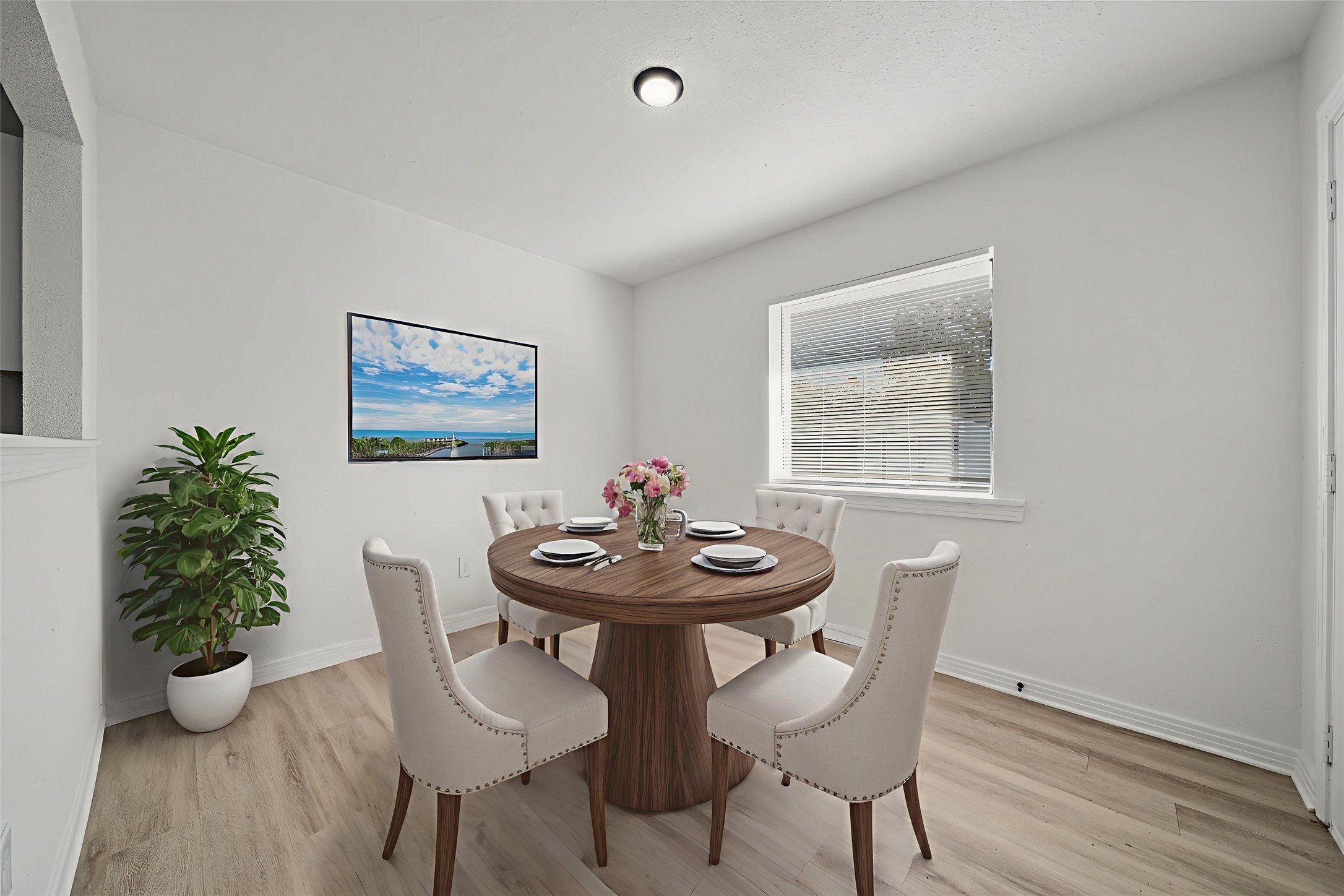 4601 West 43rd Street Houston, TX 77092 - Photo 13 of 40 a view of a dining room with furniture and wooden floor