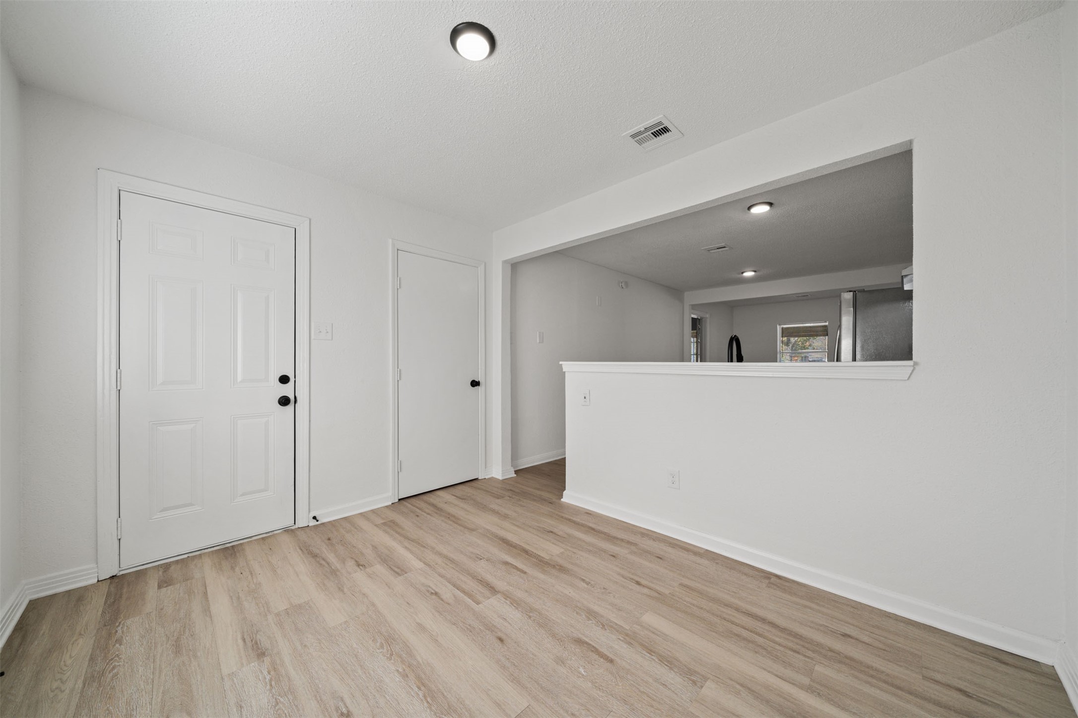 4601 West 43rd Street Houston, TX 77092 - Photo 14 of 40 a view of a big room with wooden floor and windows