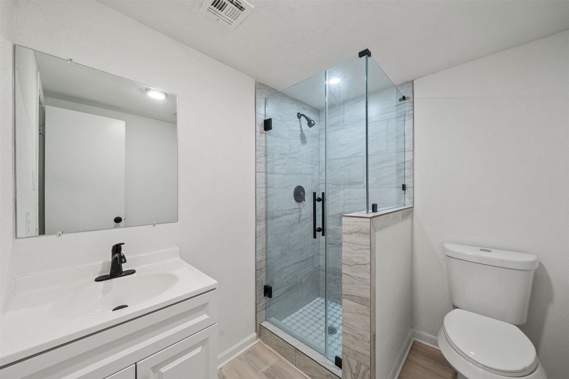 4601 West 43rd Street Houston, TX 77092 - Photo 19 of 40 a bathroom with a sink toilet and shower