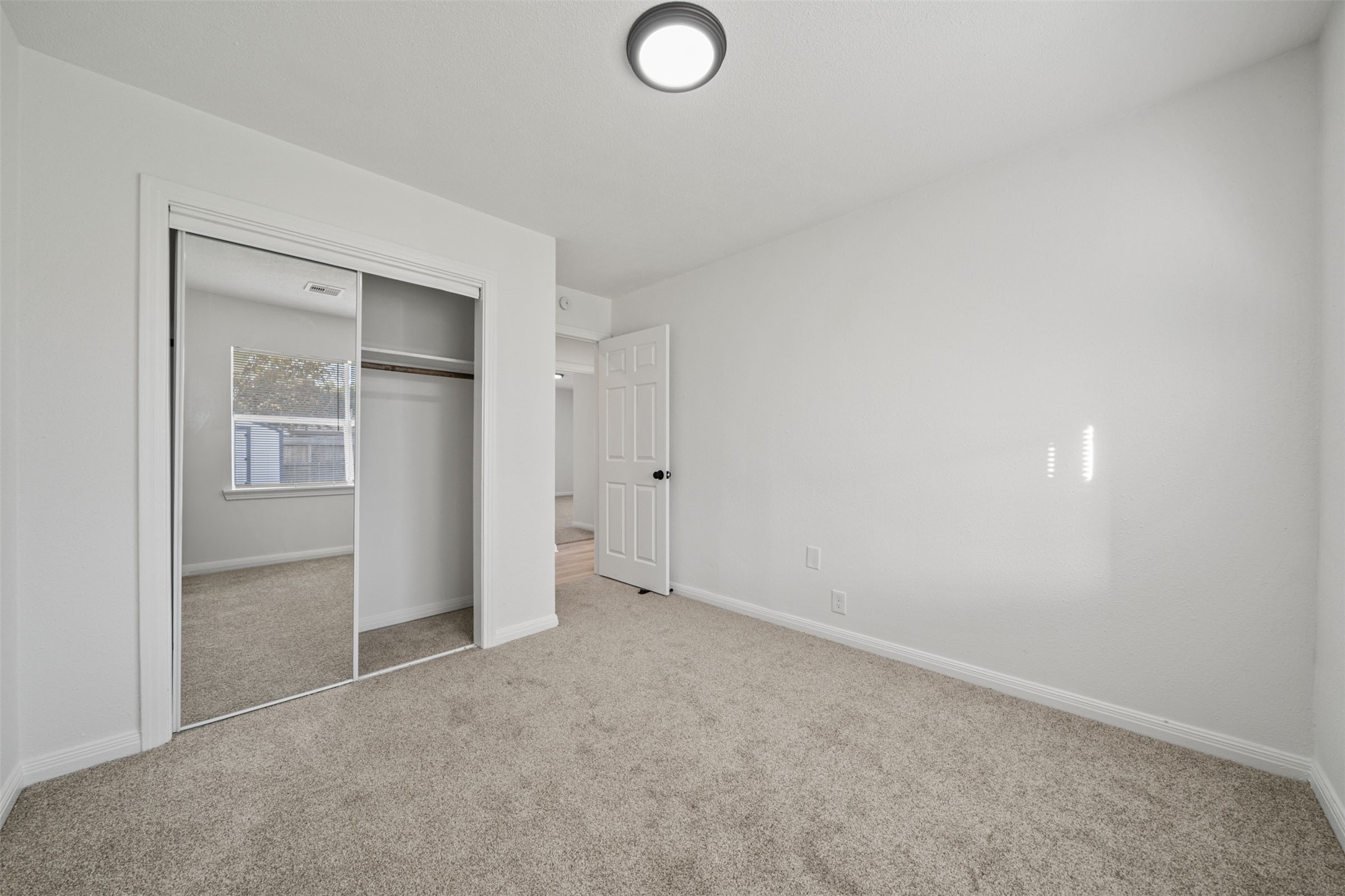 4601 West 43rd Street Houston, TX 77092 - Photo 21 of 40 an empty room with closet and windows