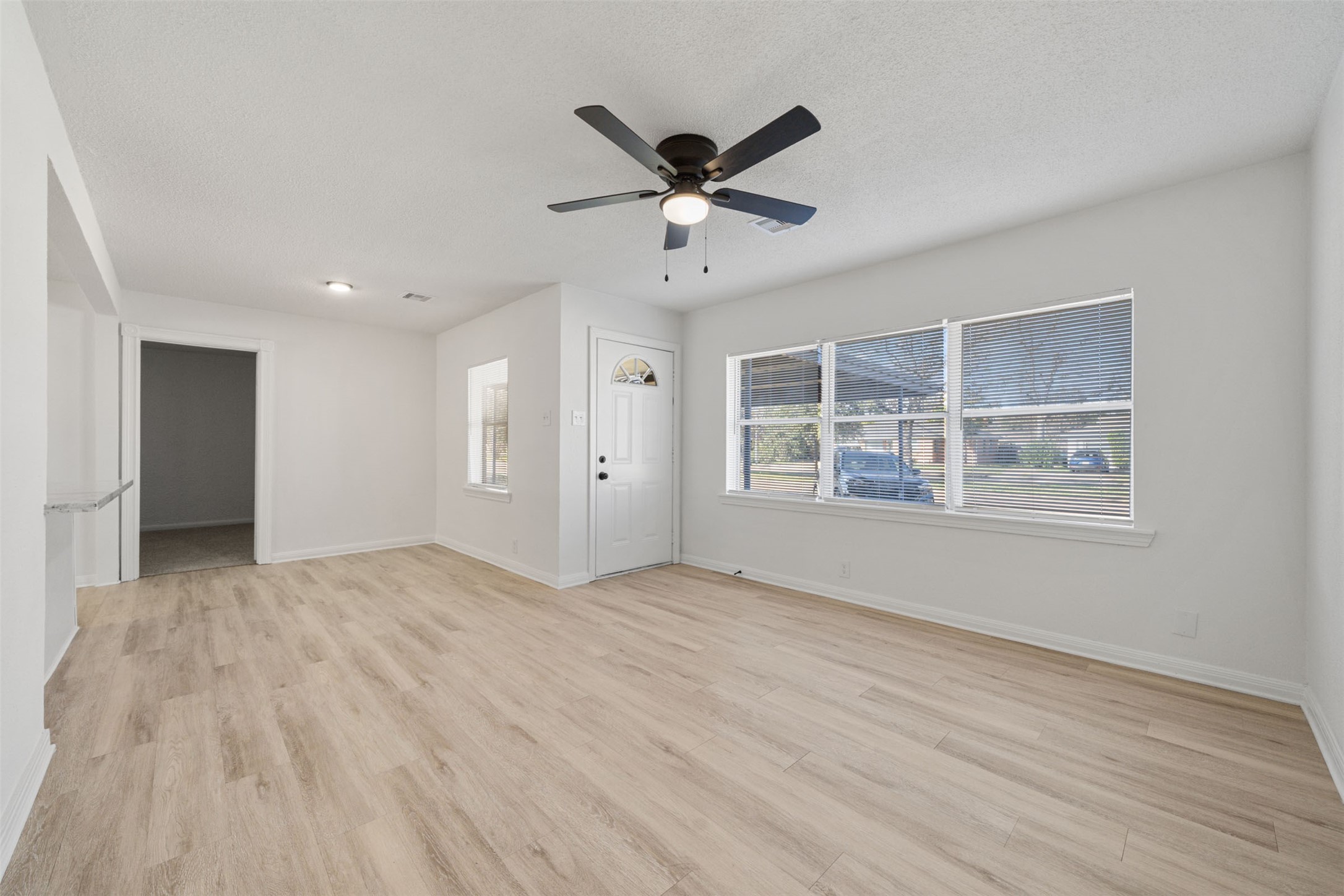 4601 West 43rd Street Houston, TX 77092 - Photo 4 of 40 a view of an empty room with a window