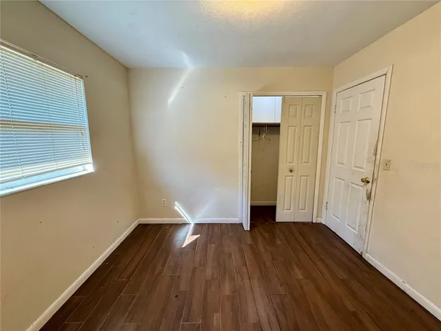 a view of wooden floor in an empty room