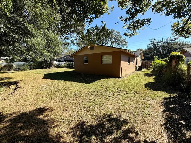a front view of a house with a yard covered with snow