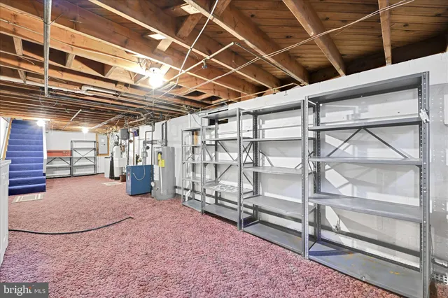 a view of an empty room with racks on the wall