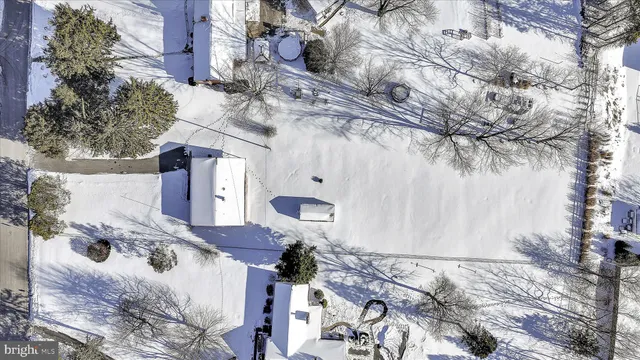 a backyard of a house with large trees
