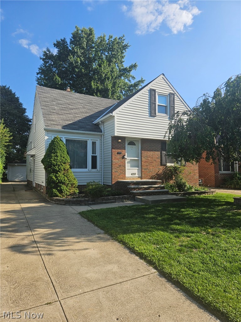 4237 Stonehaven Road South Euclid, OH 44121 - Photo 1 of 35 Two-story exterior with brick and siding facade, featuring a prominent front gable and a concrete driveway
