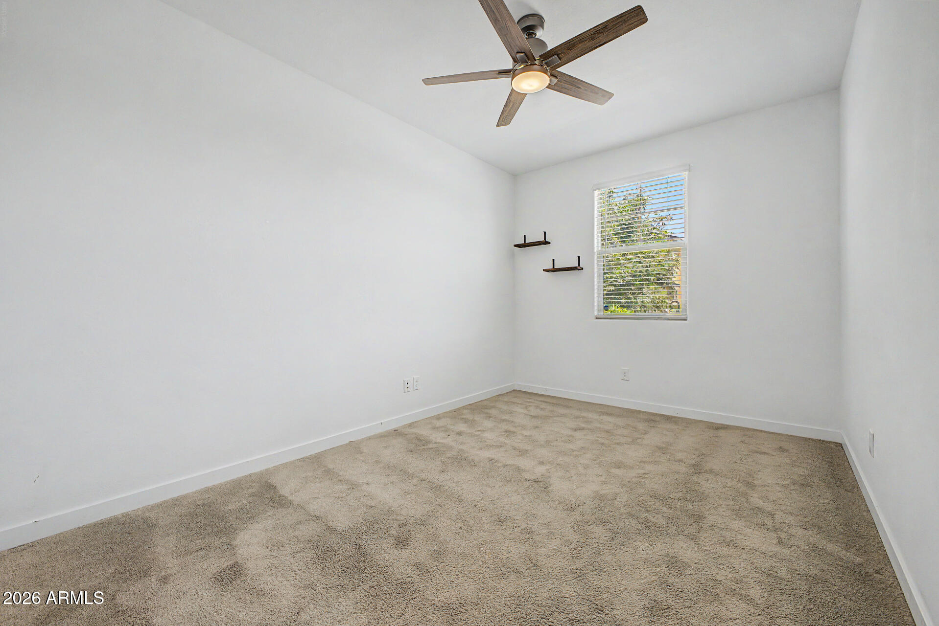 23080 East Stacey Road Queen Creek, AZ 85142 - Photo 22 of 42 an empty room with windows and fan