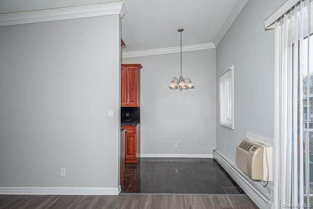 234 River Avenue, Unit 93 Patchogue, NY 11772 - Photo 5 of 11 wooden floor in an empty room with a window