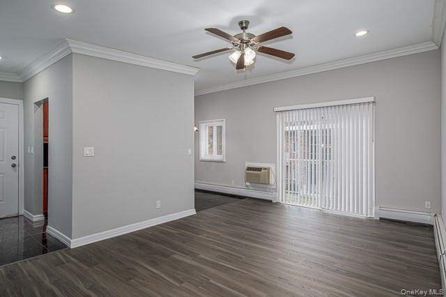 234 River Avenue, Unit 93 Patchogue, NY 11772 - Photo 6 of 11 an empty room with wooden floor and windows