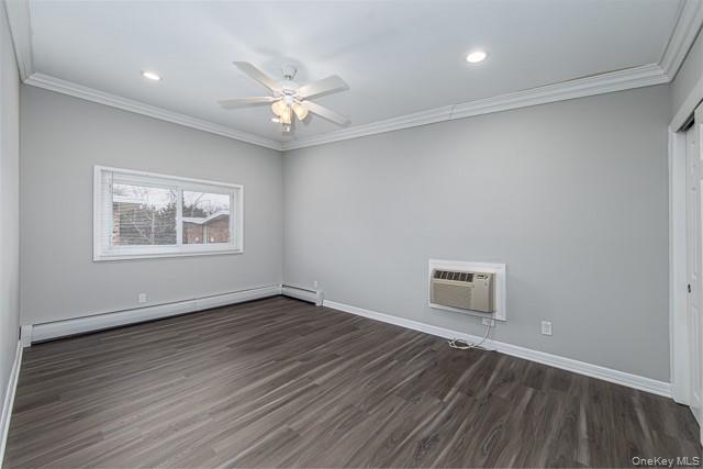 234 River Avenue, Unit 93 Patchogue, NY 11772 - Photo 7 of 11 an empty room with wooden floor chandelier fan and windows