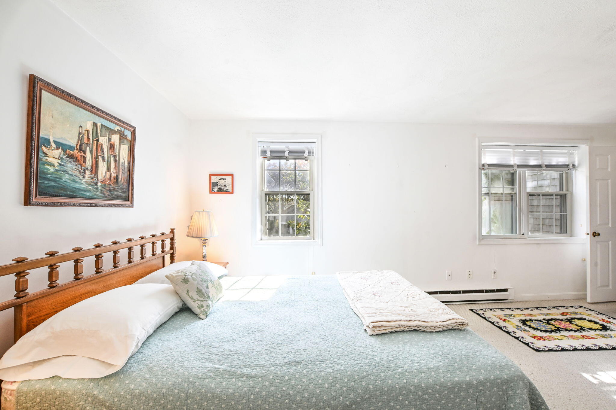 48 Highview Drive, Unit 48 Sandwich, MA 02563 - Photo 16 of 33 a bedroom with a bed and a painting on the wall