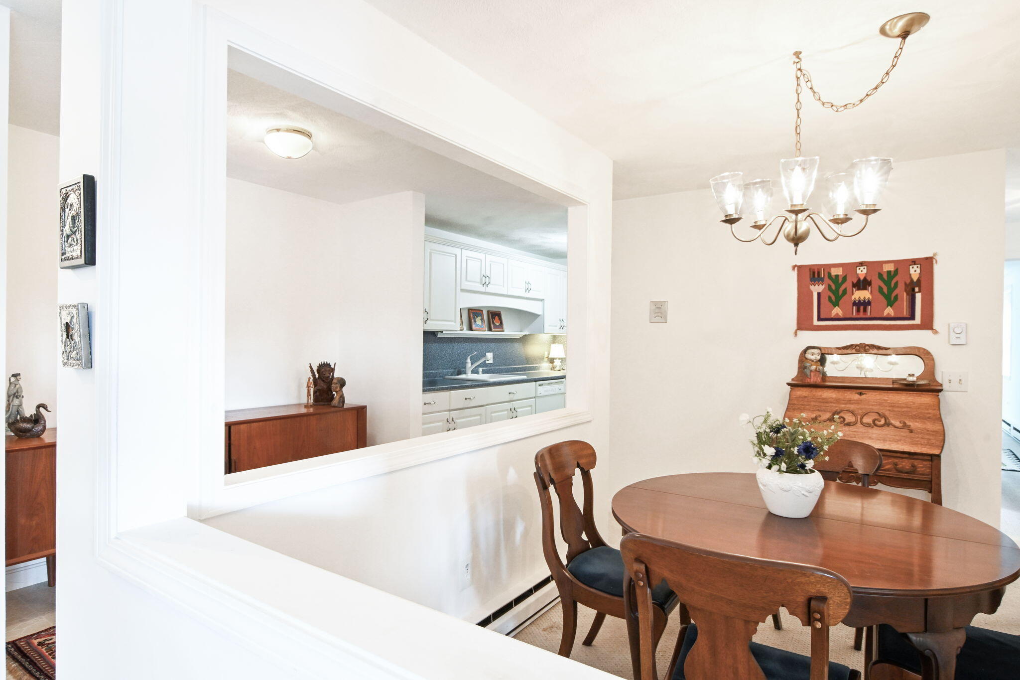 48 Highview Drive, Unit 48 Sandwich, MA 02563 - Photo 9 of 33 a view of a dining room with furniture a chandelier and wooden floor