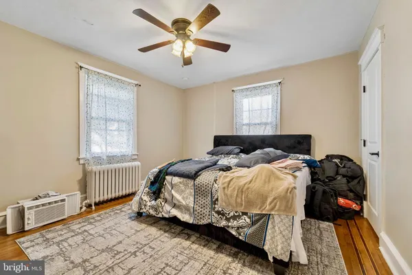 a bedroom with bed and window