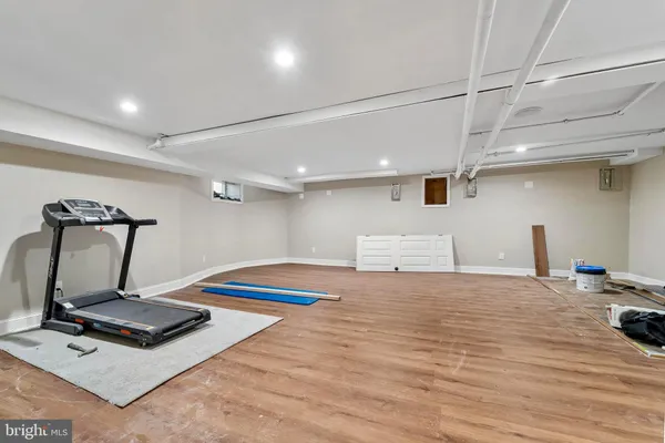 a room with gym equipment and a table