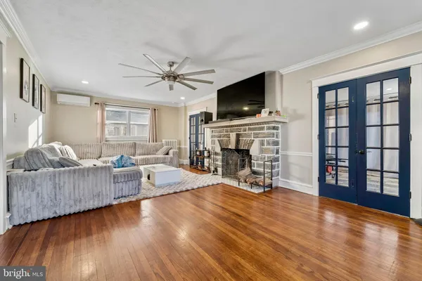a living room with fireplace furniture and a flat screen tv
