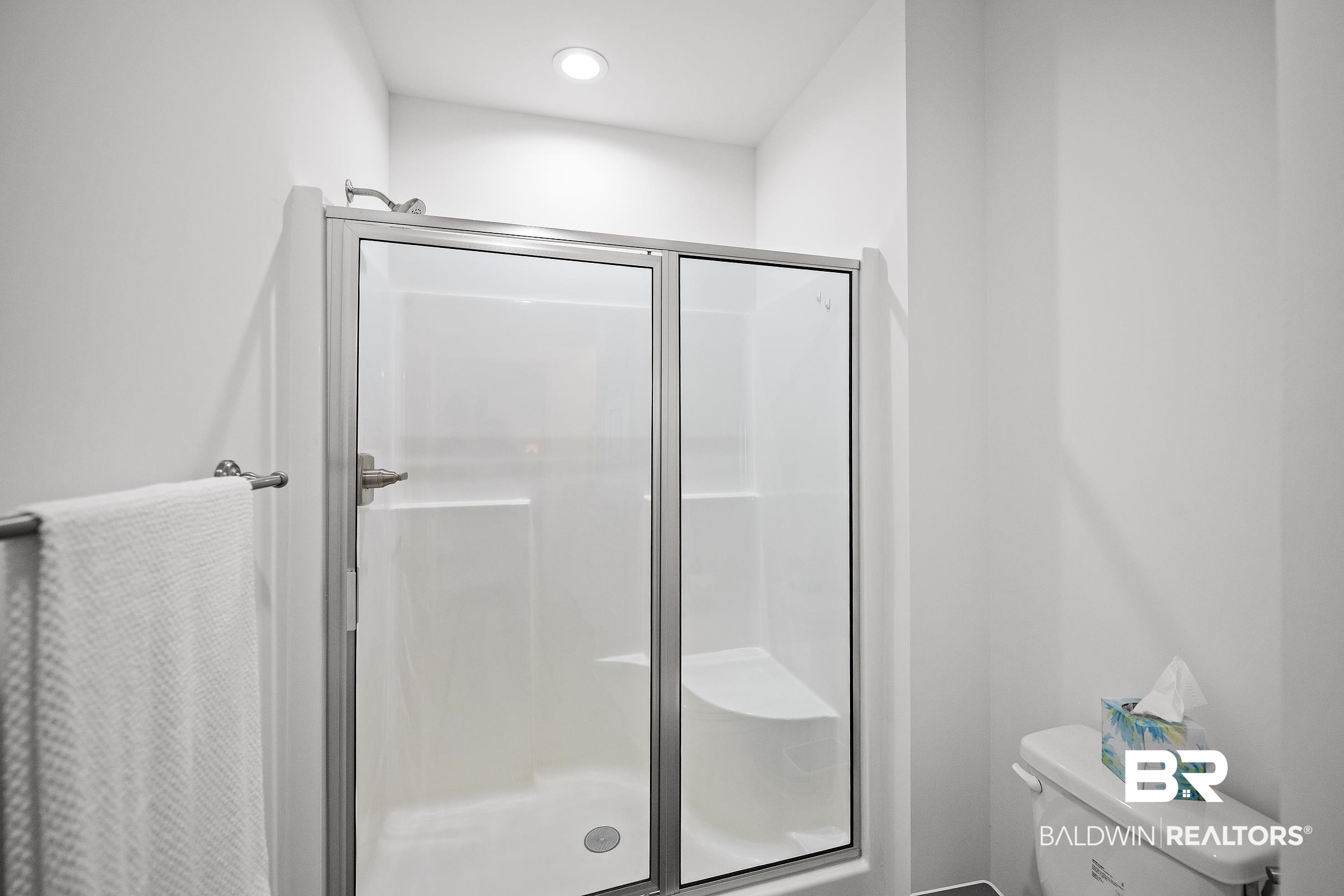 2651 South Juniper Street, Unit 2002 Foley, AL 36535 - Photo 13 of 23 Shower enclosure with clear glass doors and brushed nickel hardware