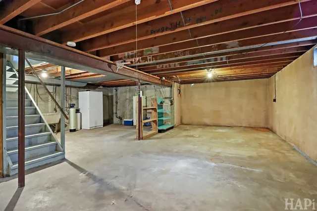 a view of an empty room with stairs