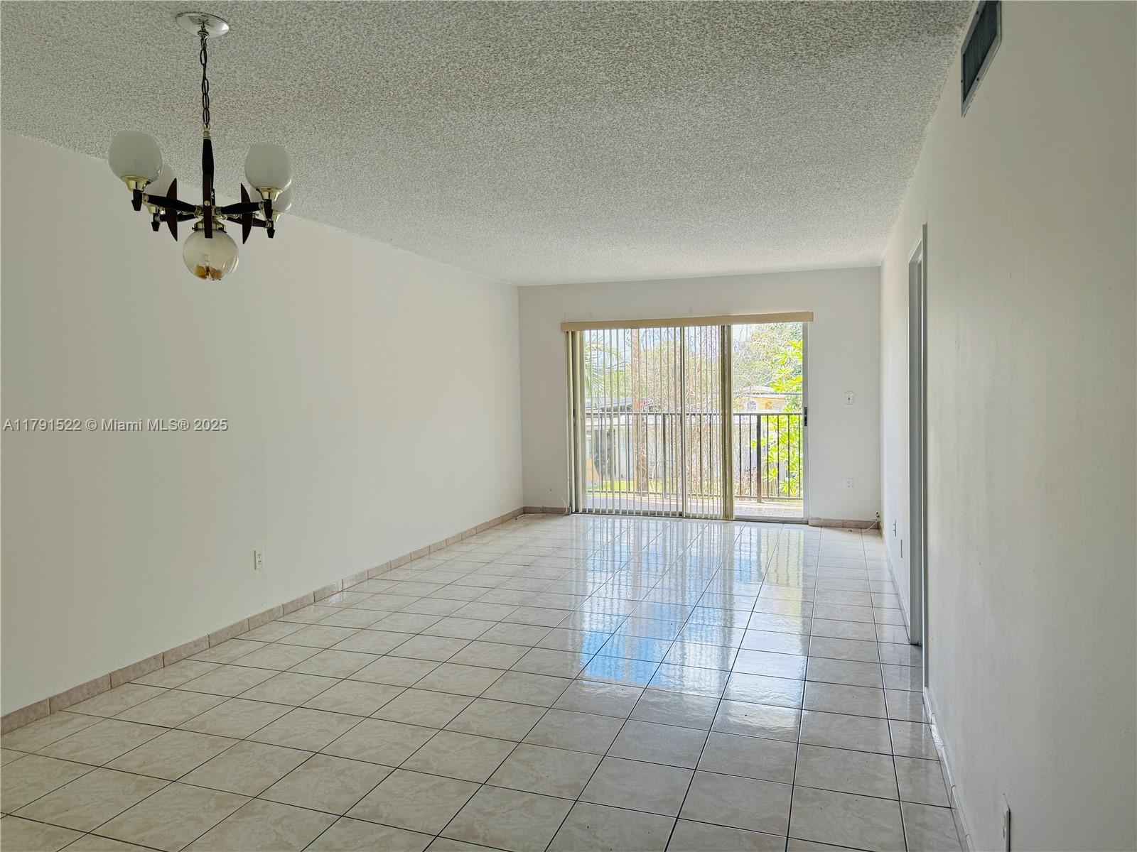 30 East 39th Street, Unit 217 Hialeah, FL 33013 - Photo 13 of 50 a view of an empty room and a window