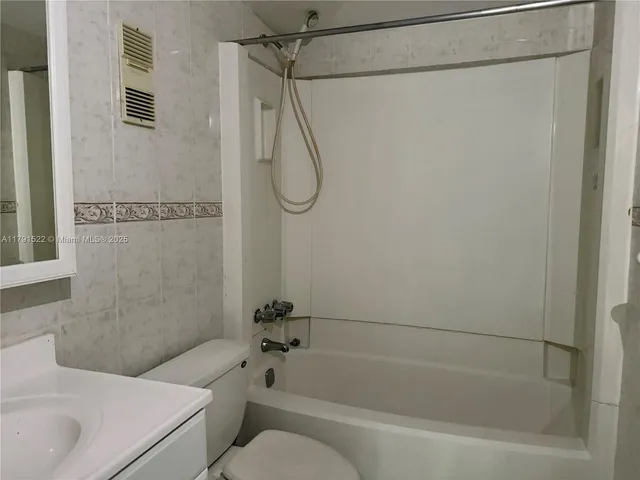 a bathroom with a sink a toilet and a bathtub