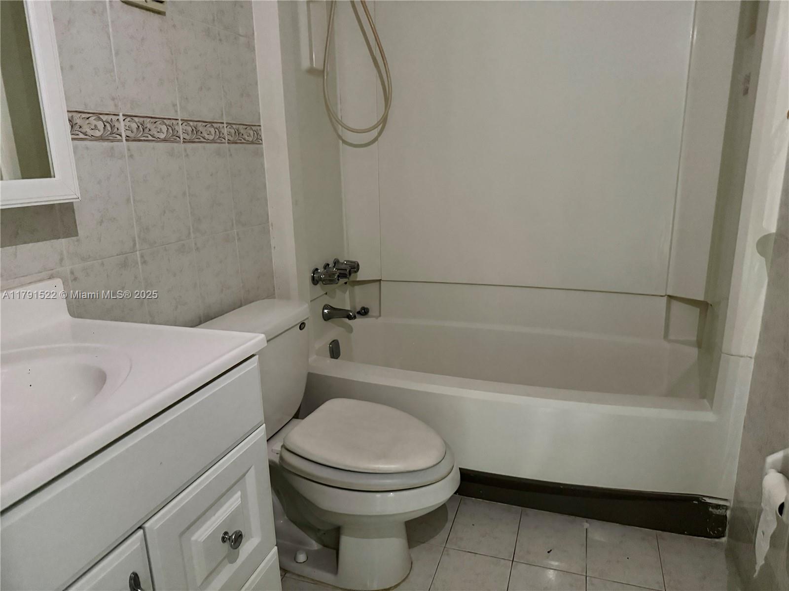 30 East 39th Street, Unit 217 Hialeah, FL 33013 - Photo 25 of 50 a bathroom with a sink a toilet and a bathtub