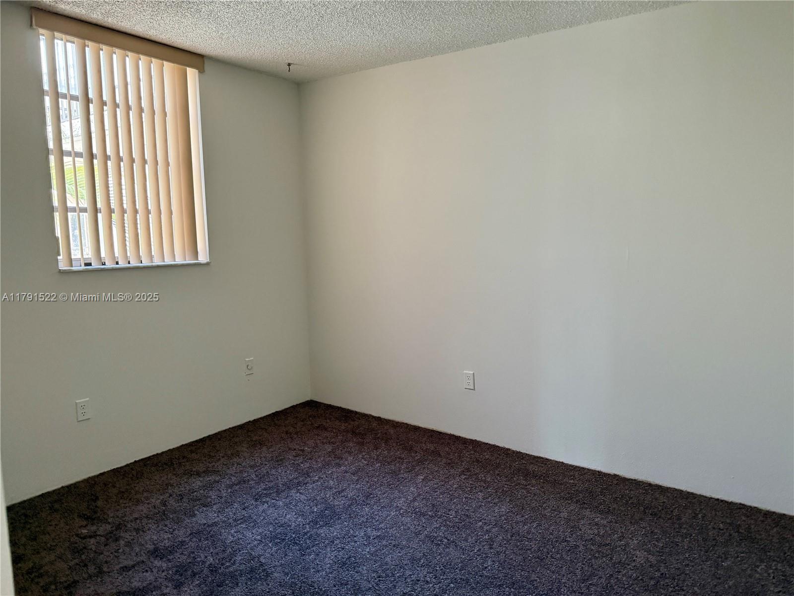 30 East 39th Street, Unit 217 Hialeah, FL 33013 - Photo 28 of 50 an empty room with a window