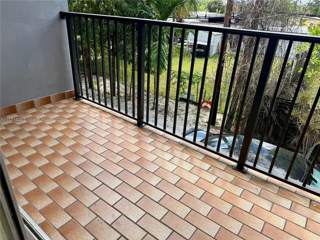 a view of a balcony with chairs