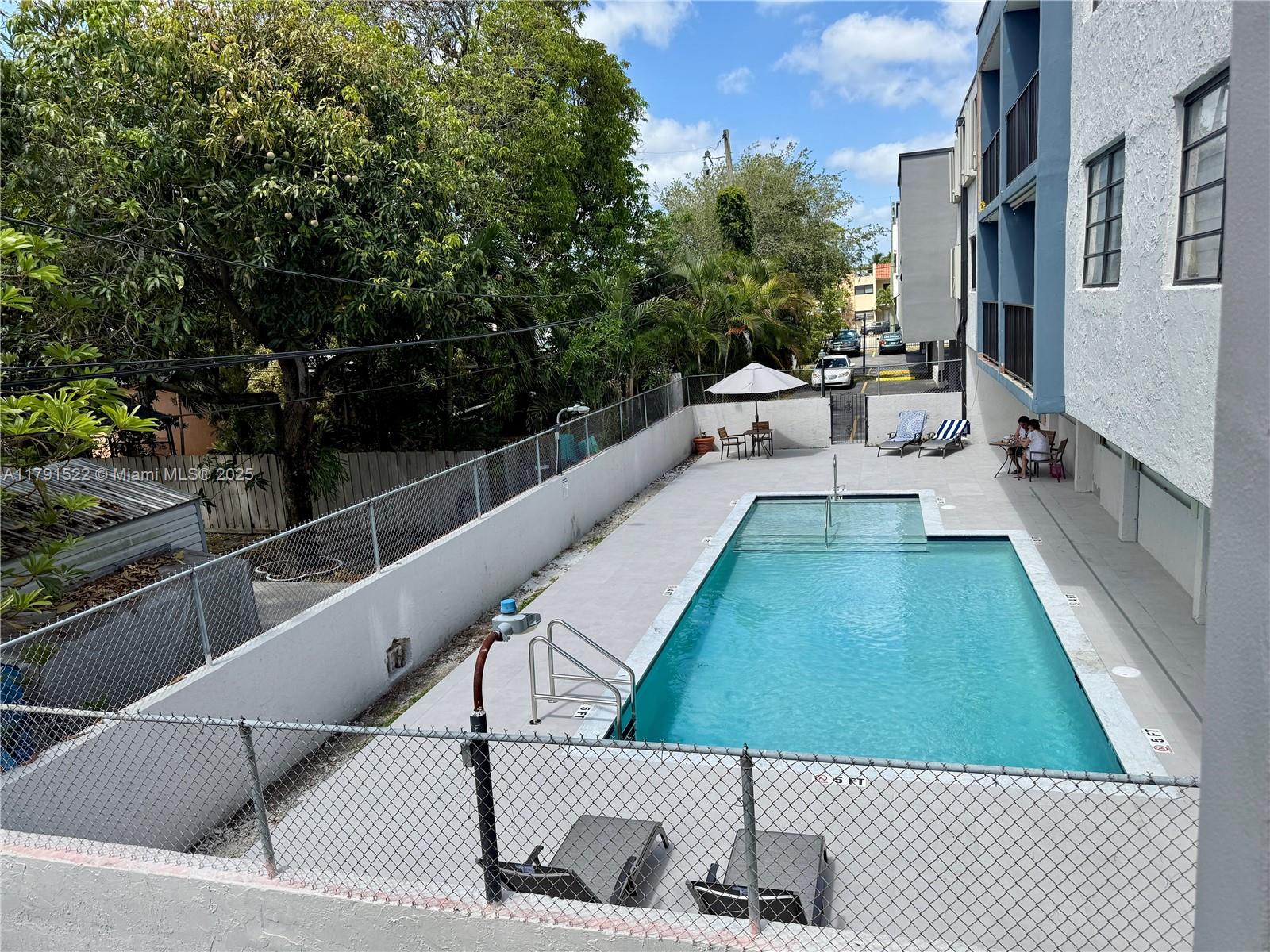 30 East 39th Street, Unit 217 Hialeah, FL 33013 - Photo 38 of 50 a view of a balcony with chairs