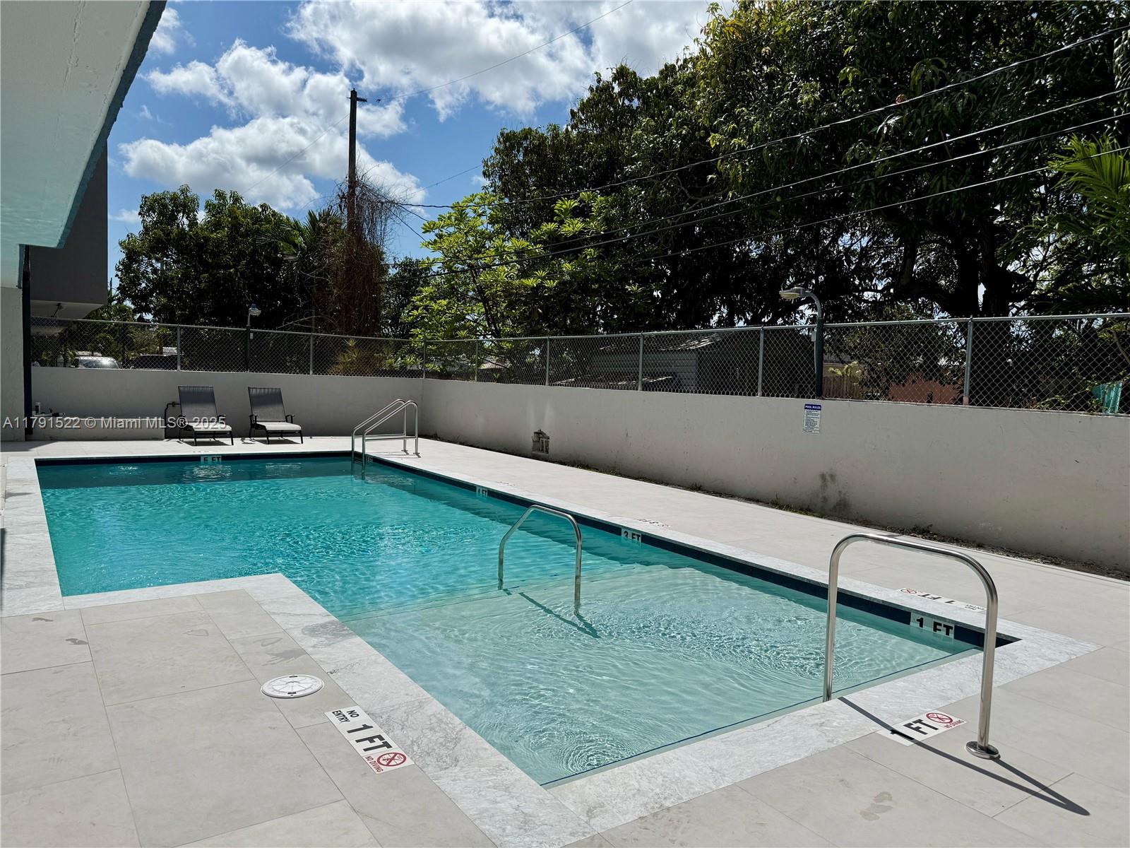 30 East 39th Street, Unit 217 Hialeah, FL 33013 - Photo 39 of 50 a view of a backyard with sitting area