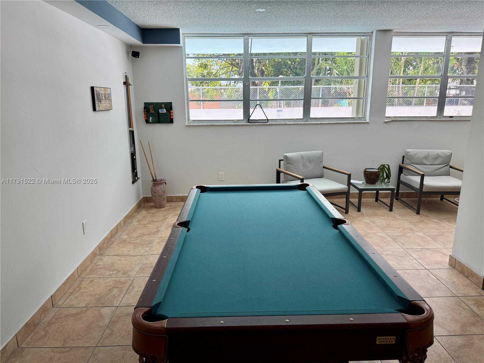30 East 39th Street, Unit 217 Hialeah, FL 33013 - Photo 42 of 50 a room with pool table and windows