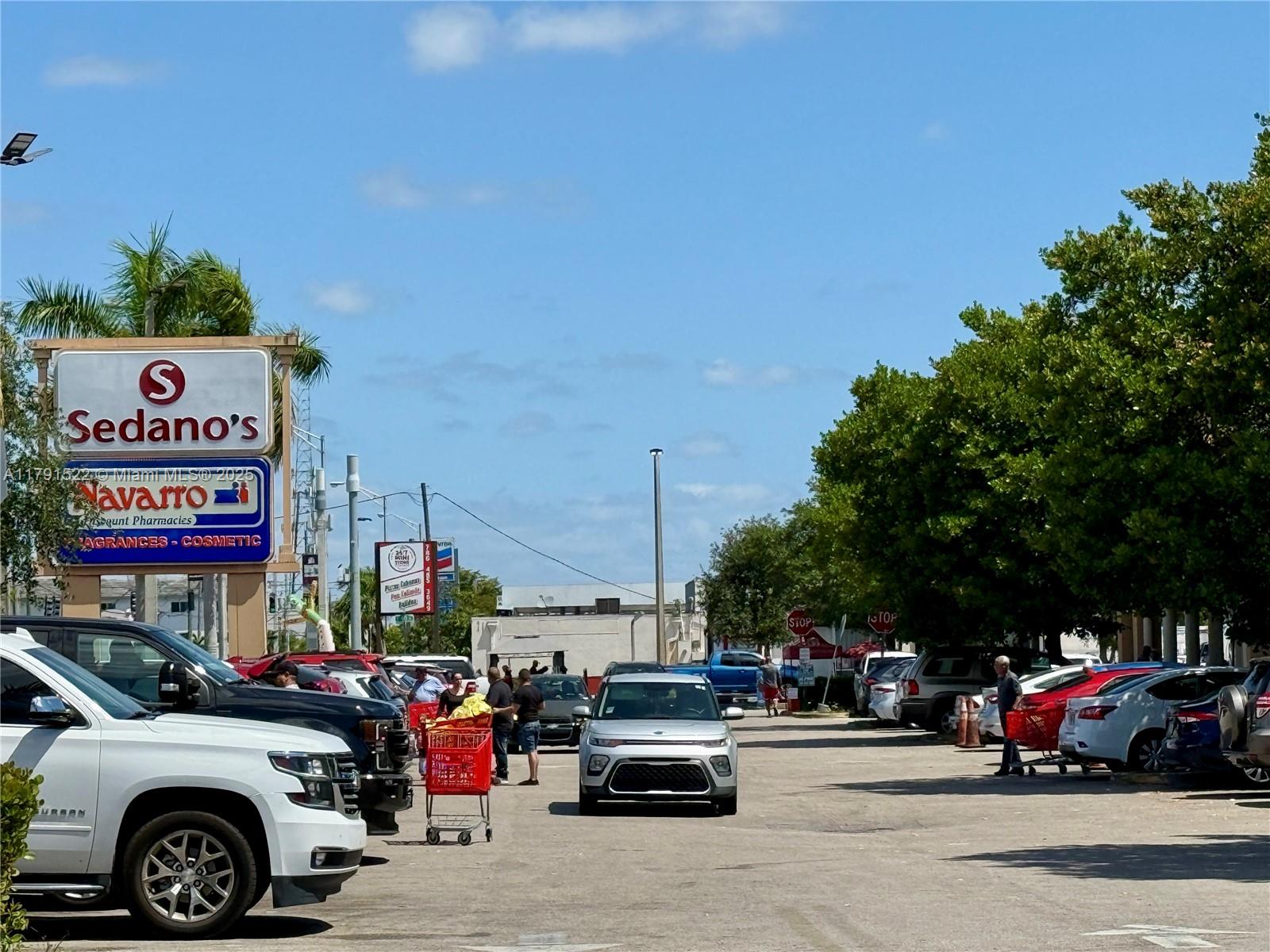 30 East 39th Street, Unit 217 Hialeah, FL 33013 - Photo 49 of 50 a view of cars parked in front of a building