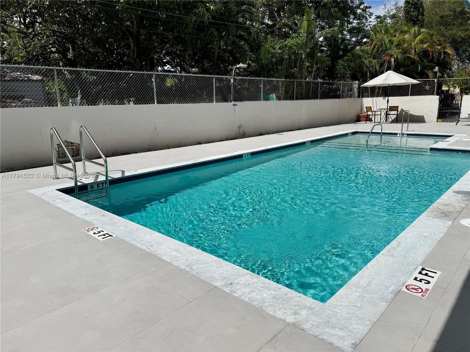 30 East 39th Street, Unit 217 Hialeah, FL 33013 - Photo 6 of 50 a view of a terrace with chairs