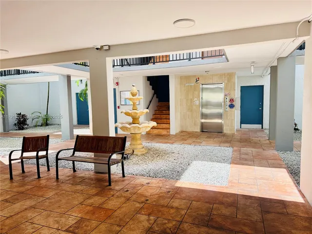 a view of a livingroom with furniture and window