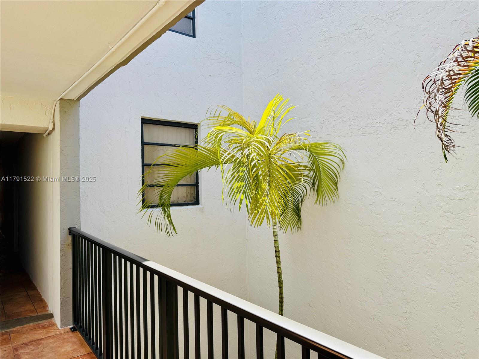 30 East 39th Street, Unit 217 Hialeah, FL 33013 - Photo 9 of 50 a view of balcony and staircase