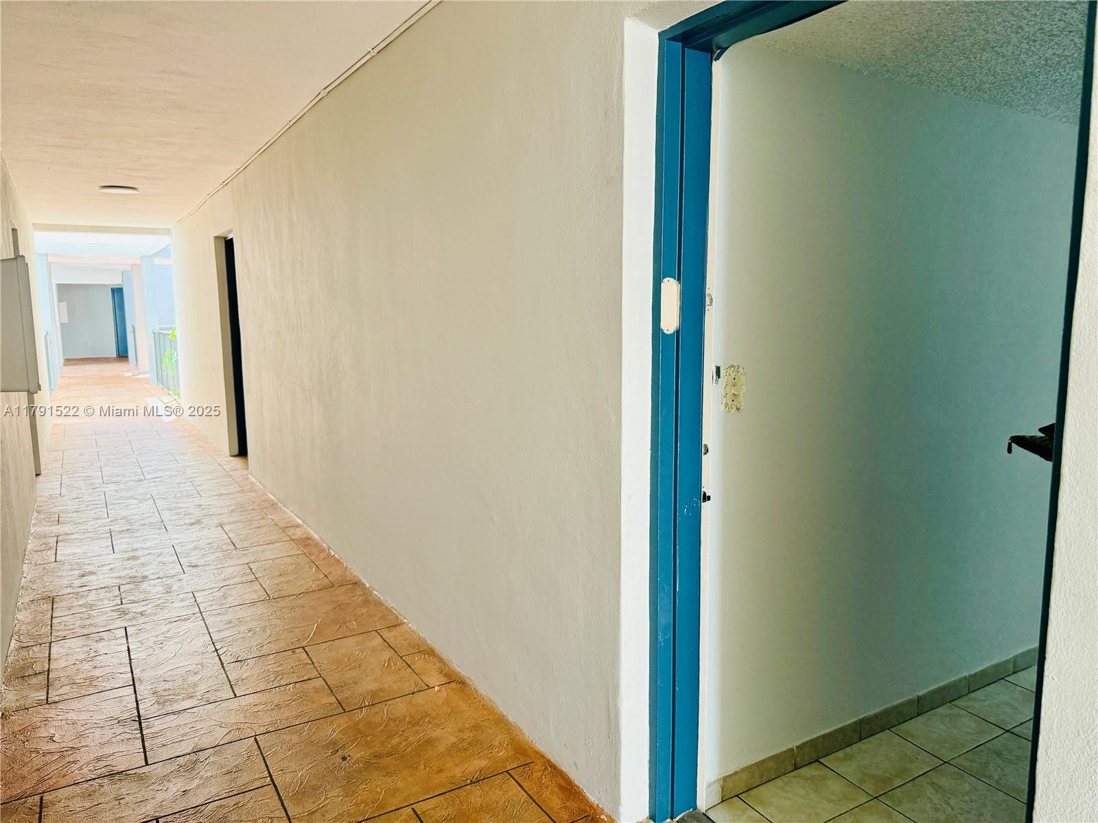 30 East 39th Street, Unit 217 Hialeah, FL 33013 - Photo 10 of 50 a view of a hallway