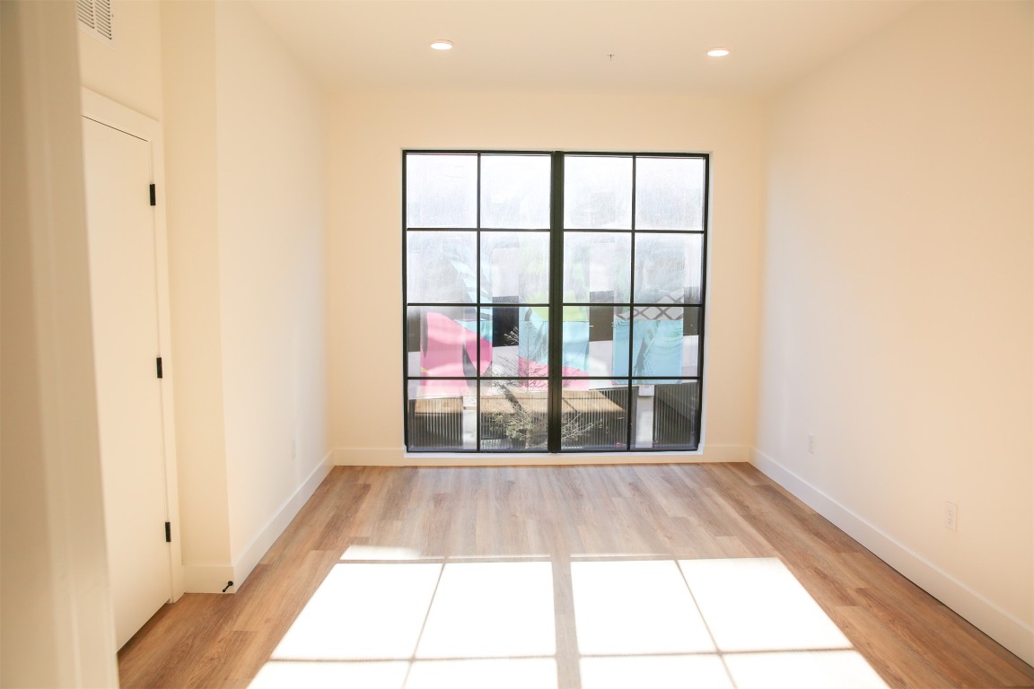 4315 South Congress Avenue, Unit 207 Austin, TX 78745 - Photo 7 of 12 a view of empty room with windows