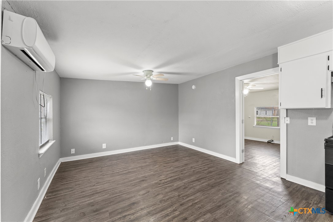 508 Rhode Island Street Killeen, TX 76541 - Photo 3 of 8 a view of an empty room with kitchen and a window